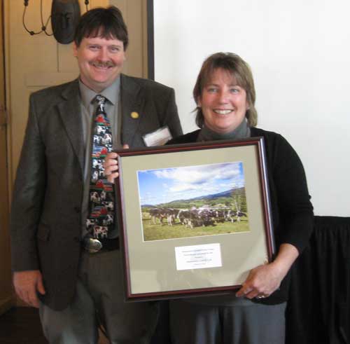 President of Massachusetts Association of Dairy Farmers presenting Anne Gobi with the MADF Agricultural Advocate of the Year Award
